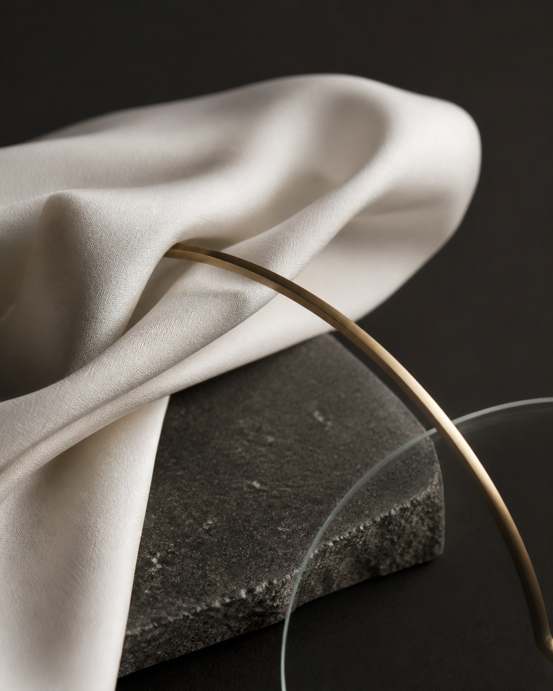 Editorial material study in IAVE's ivory, charcoal, and champagne palette